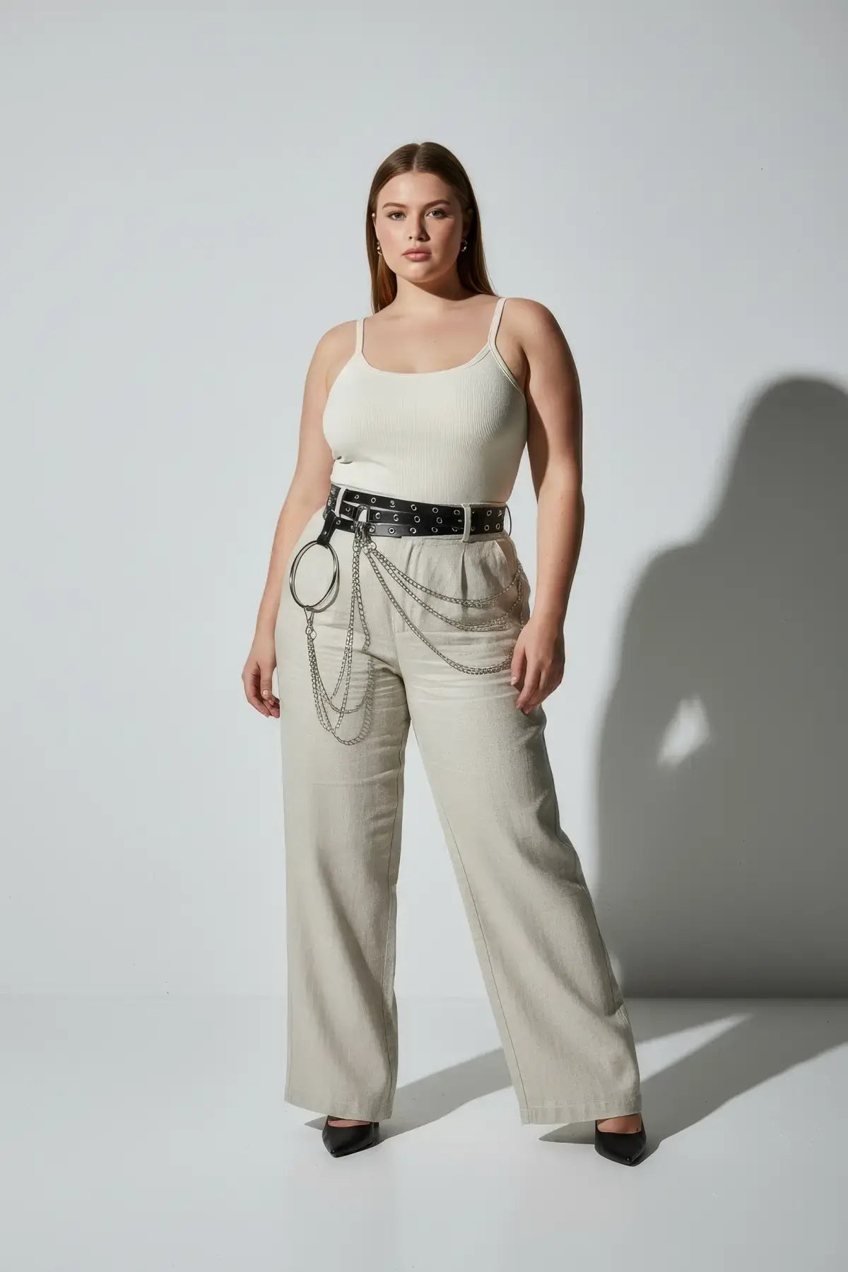 HarnessClub plus-size black vegan leather belt with grommets, O-ring and chain detail