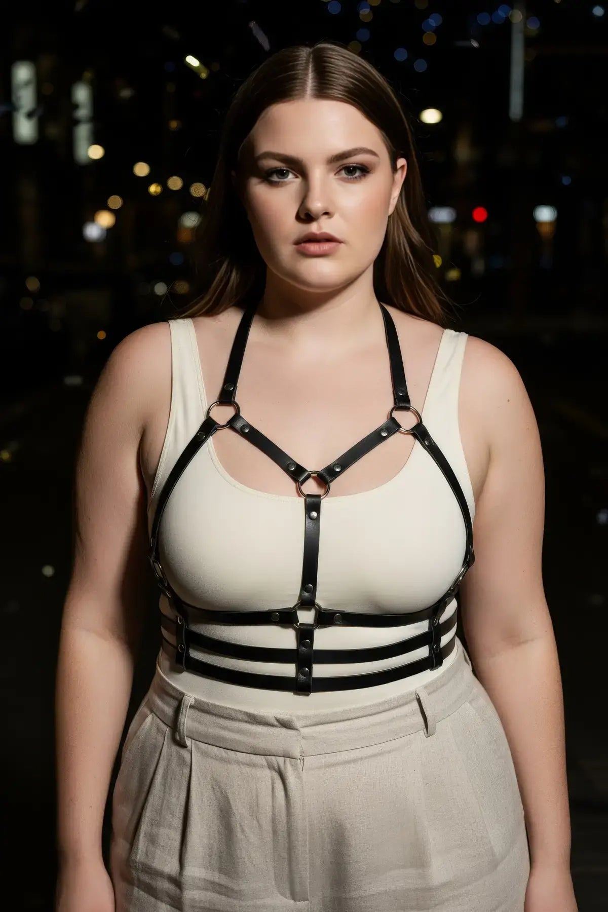 Plus-size black vegan leather chest harness with halter straps and ribcage cage bands