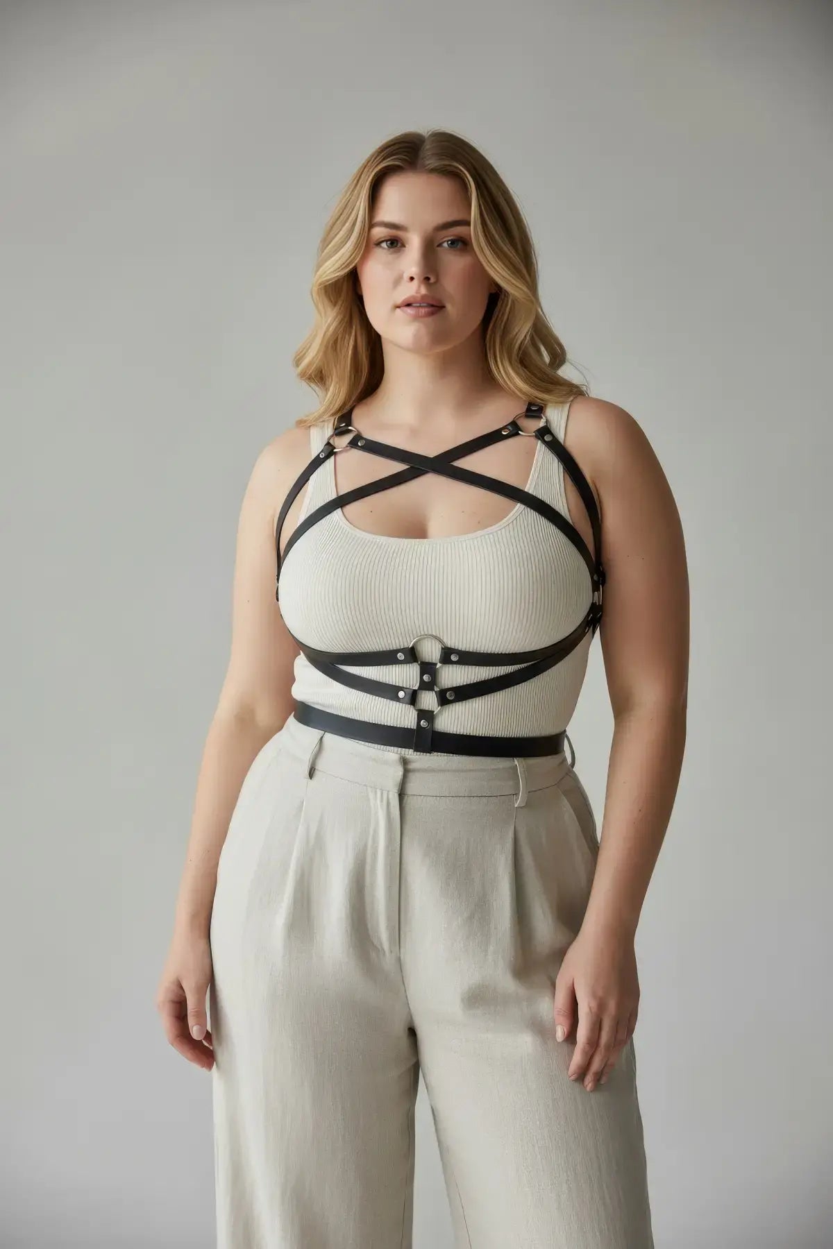 HarnessClub plus-size black leather harness-style body accessory with crossfront straps and metal hardware