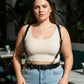 Plus-size black leather harness with O-ring hardware worn as a body accessory
