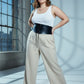 Plus Size Black Lace-Up Corset Body Harness by HarnessClub worn over a white tank top with a black waist cincher.