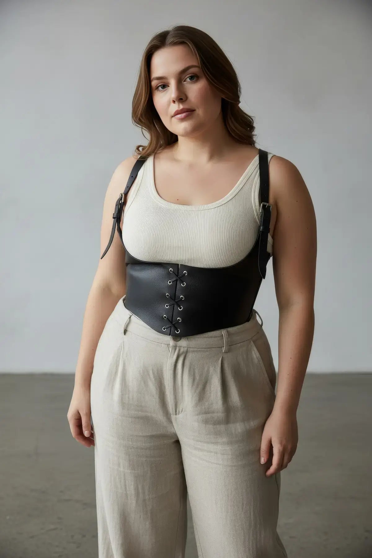 Plus-size black vegan leather lace-up corset harness with front lace detail
