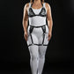Plus-size black lace-up leather harness set with garter belt worn over white bodysuit
