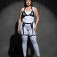 Plus-size black vegan-leather lace-up harness and garter belt set worn over a white bodysuit.