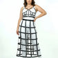 Plus-size black long cage skirt and chest harness set on model, vegan leather grid pattern