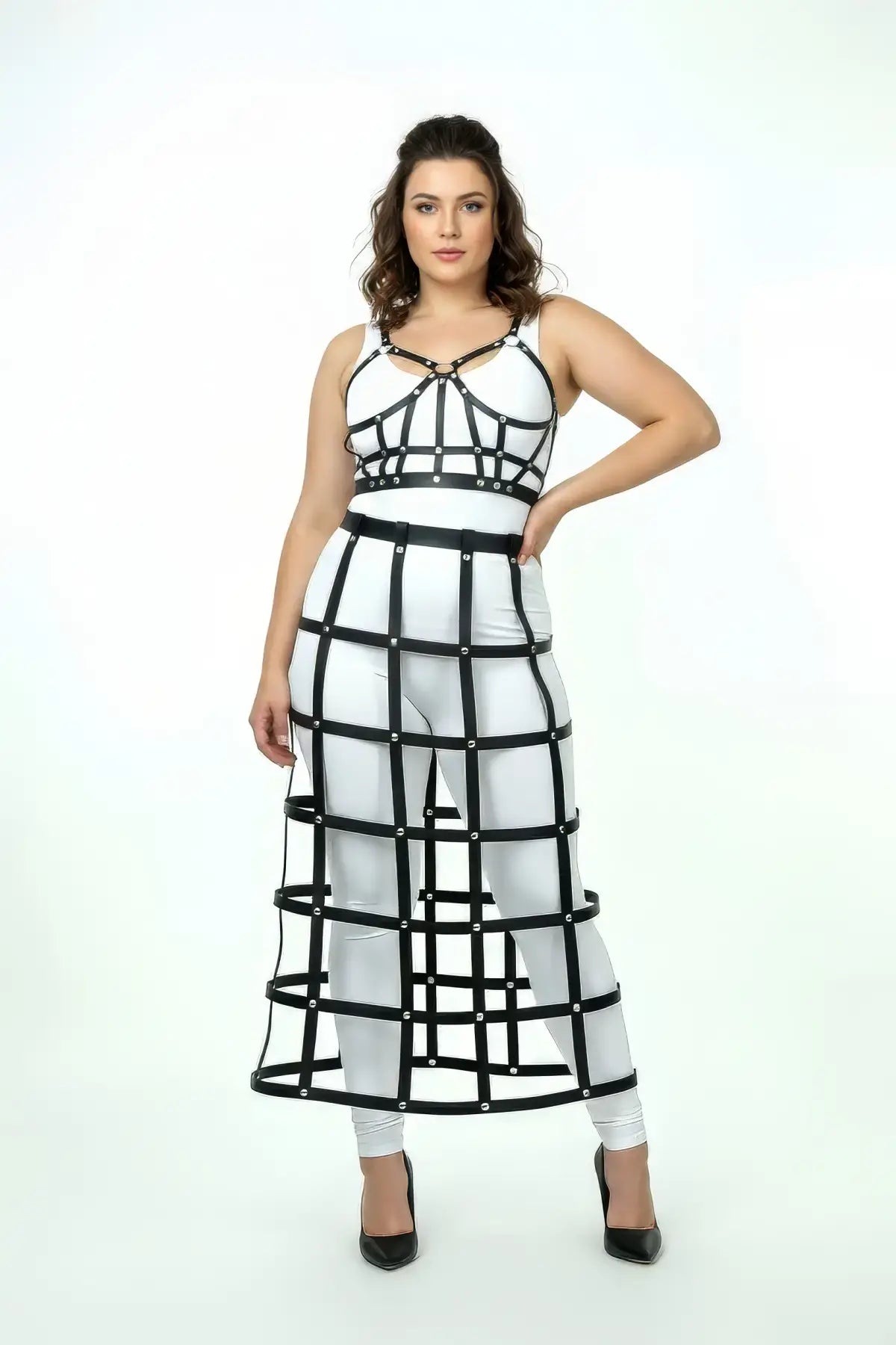 Plus-size black long cage skirt and chest harness set on model, vegan leather grid pattern