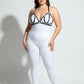 HarnessClub plus-size black vegan leather M-strap bra harness with studs worn over white bodysuit