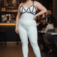Plus size black M-strap vegan leather bra harness with studs, worn over white outfit, HarnessClub.