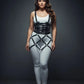 Plus-size black multi-band corset and cage harness set worn over a white bodysuit; vegan leather body accessory