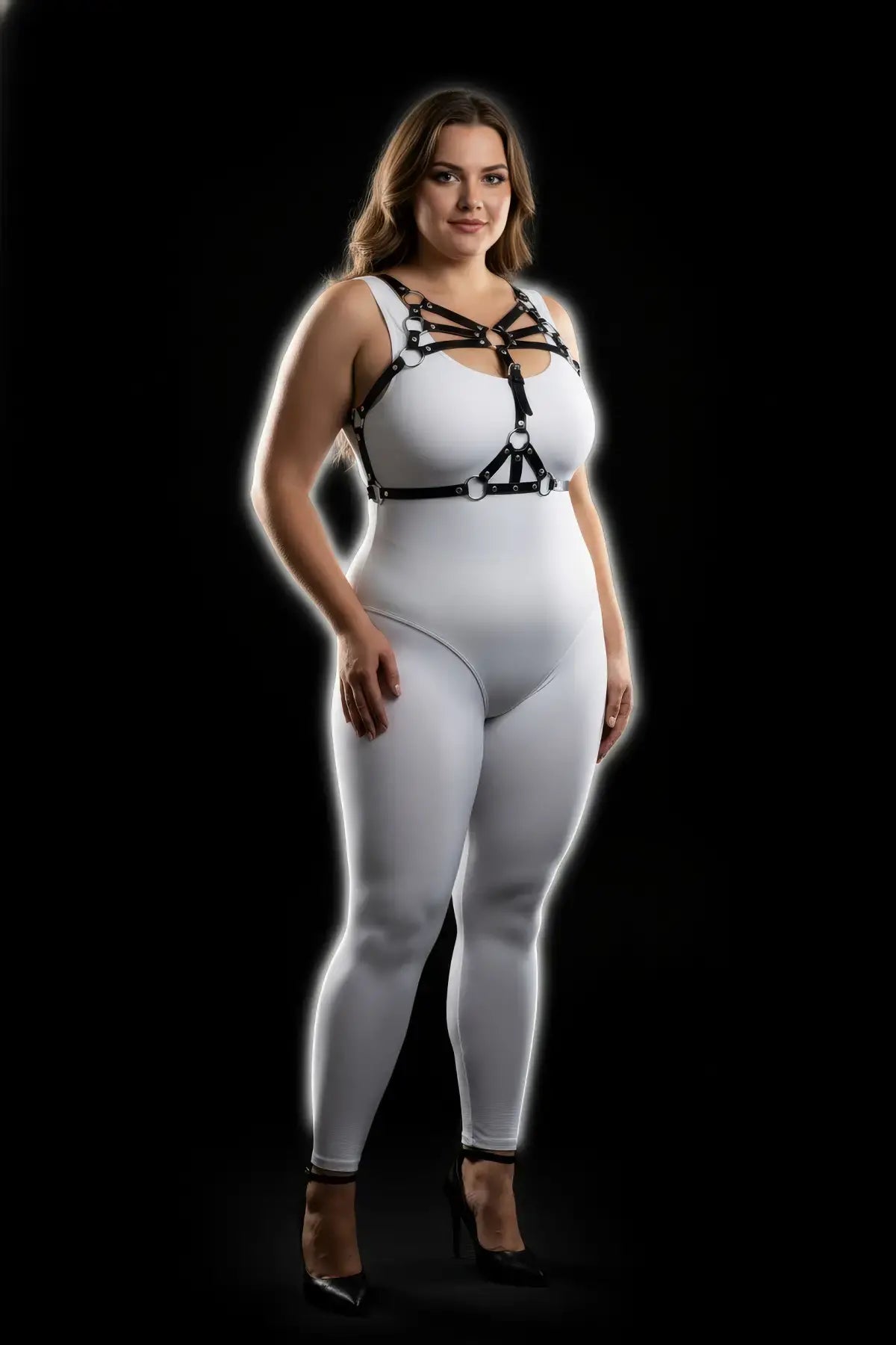 Plus-size black vegan-leather multi-band O-ring cage chest harness on white bodysuit