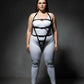 Plus Size Black Multi-Buckle Adjustable Body Harness by HarnessClub vegan leather worn over a white bodysuit