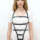 Plus size black vegan leather full-body harness with multiple buckles.
