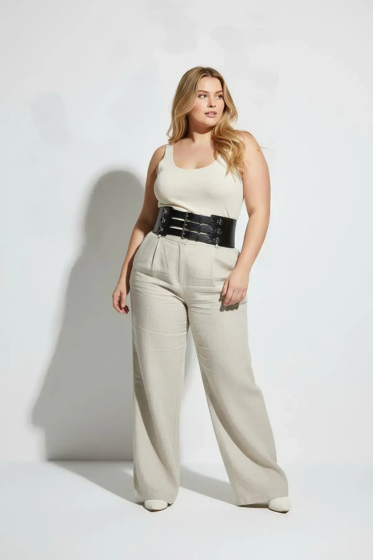 Plus size black wide corset belt with multiple buckles worn at waist