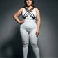 Plus size black multi-cross cage chest harness by HarnessClub, vegan leather, worn over a white bodysuit.