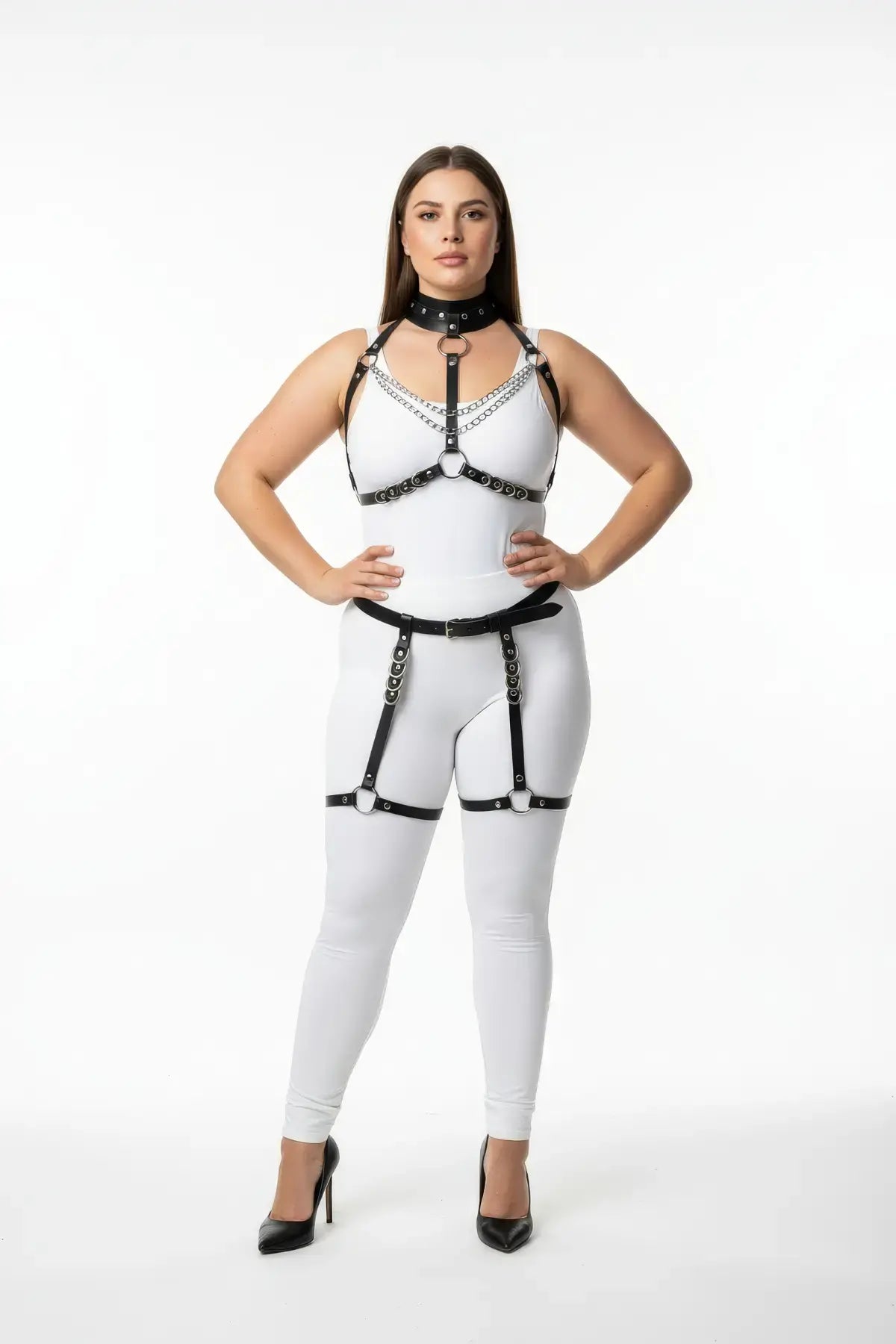 Plus-size black vegan-leather full-body harness set with O-ring and chain-drape straps on model