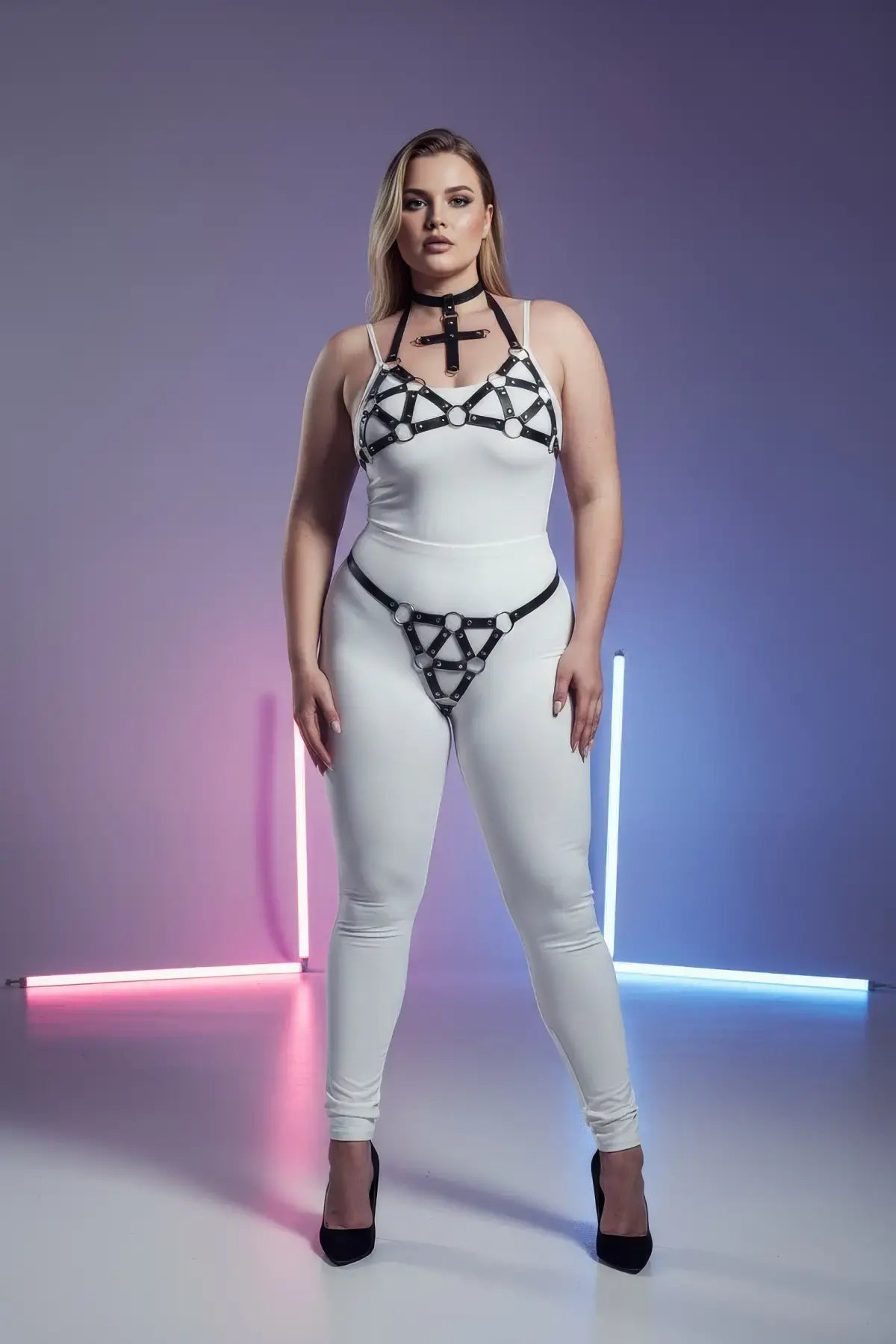 Plus-size black faux-leather O-ring body harness with chest and hip straps by HarnessClub