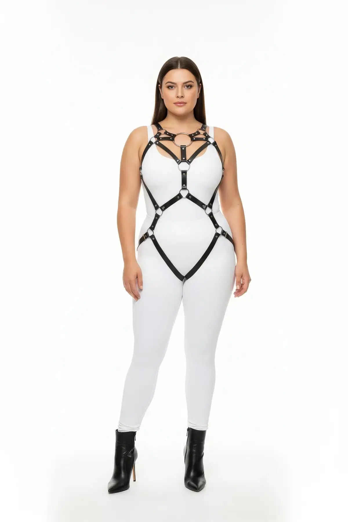 Plus-size black vegan leather O-ring full-body harness worn over white bodysuit