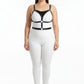 Plus-size black vegan leather chest and waist harness with metal buckles and rings on a model in a white bodysuit