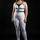 Plus-size black O-ring vegan leather chest and waist harness by HarnessClub worn by model