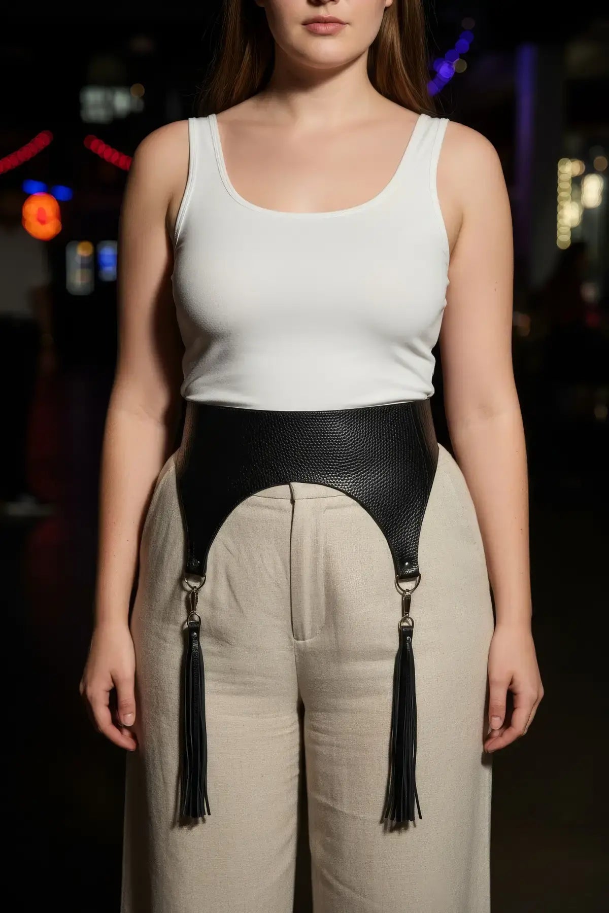 Plus-size black pebbled vegan leather corset waist belt with tassels by HarnessClub