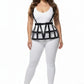 Plus-size black shoulder-strap cage waist harness in vegan leather by HarnessClub, worn over a white bodysuit.