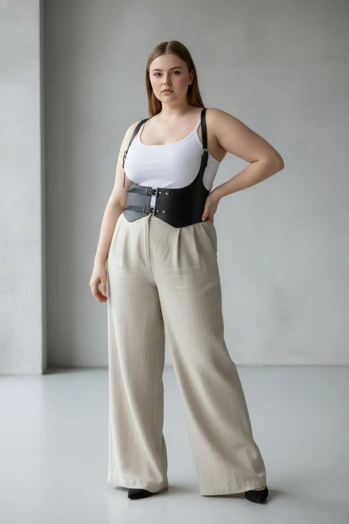 Plus-size black vegan leather shoulder-strap corset vest with double-buckle waist harness