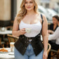 Plus-size black vegan-leather shoulder-strap harness vest with double buckles and peplum waist cincher