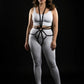 Plus size black starburst ring full body harness with vegan leather straps, worn over white activewear.