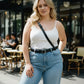 Plus size black strappy leather belt worn diagonally across the chest as a crossbody accessory