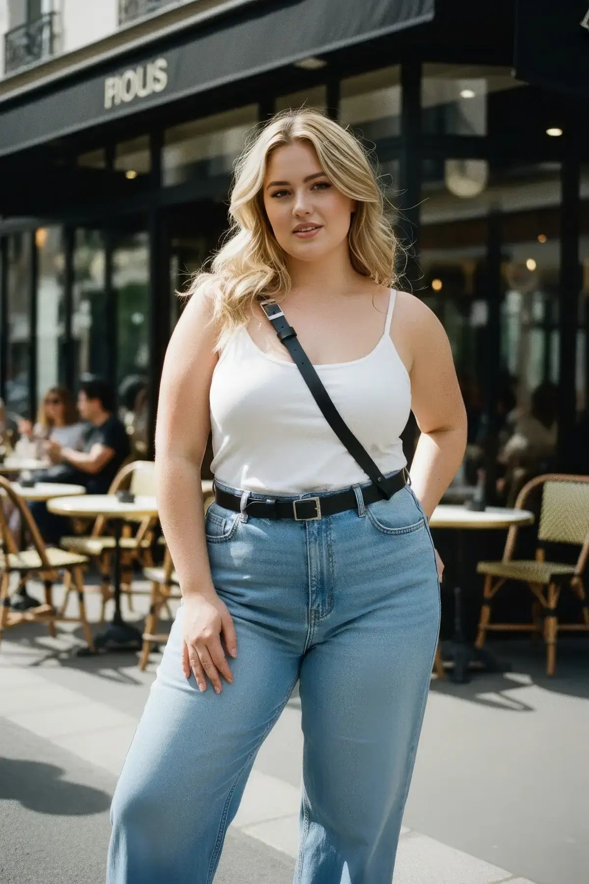 Plus size black strappy leather belt worn diagonally across the chest as a crossbody accessory