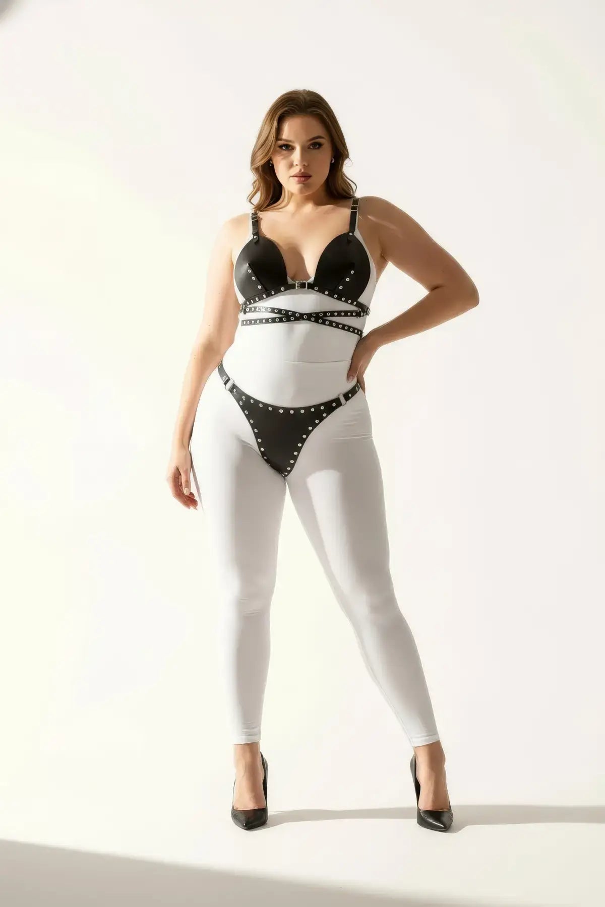 Plus size black stud-detail faux leather harness set with bra-style top and thong by HarnessClub