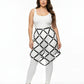 Plus Size Black Studded Lattice Cage Skirt by HarnessClub, vegan leather body harness shown over white outfit.