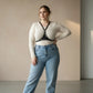 Plus Size Black Studded Leather Body Harness worn over a white long-sleeve top