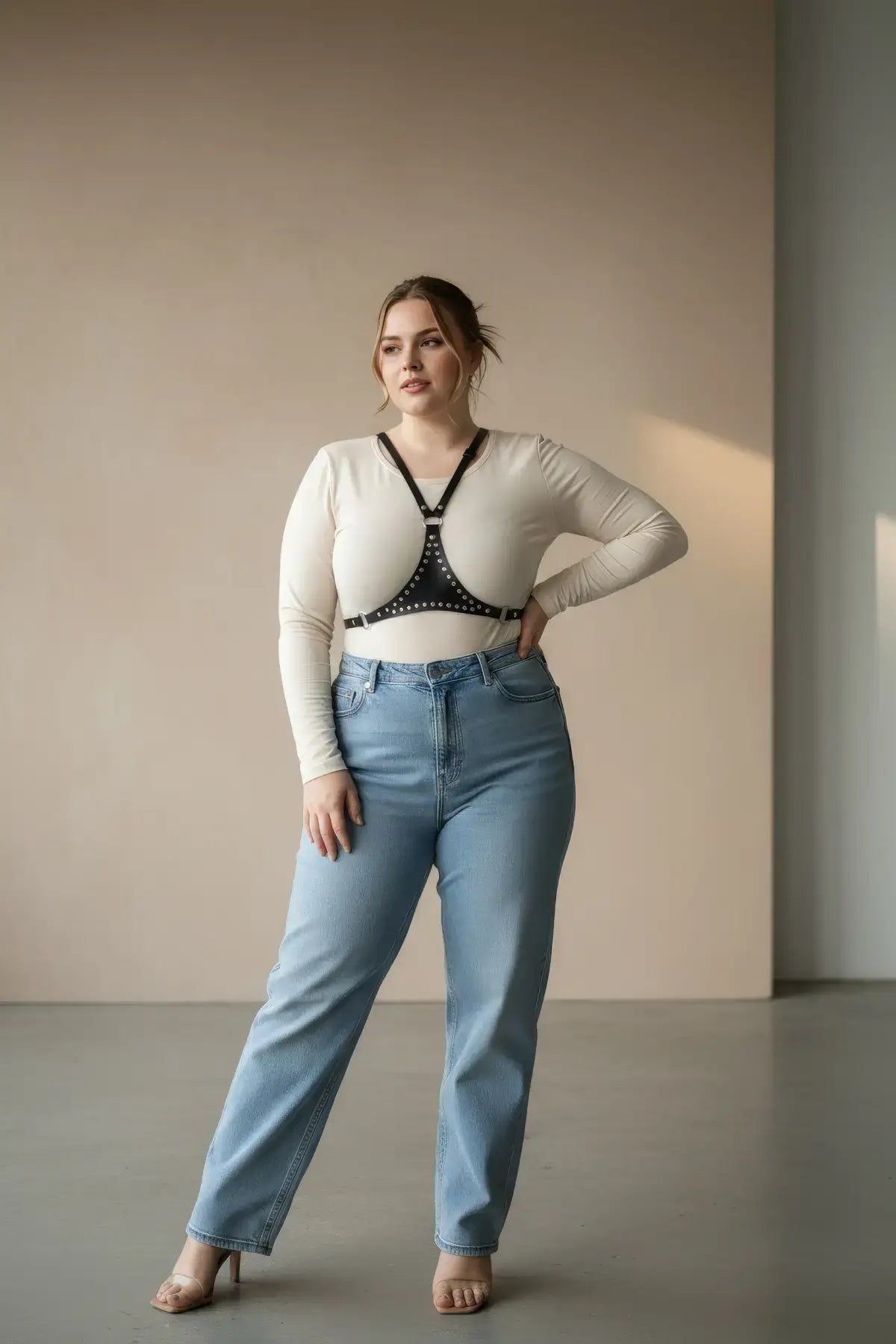 Plus Size Black Studded Leather Body Harness worn over a white long-sleeve top