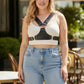 Plus Size Black Studded Leather Body Sash by HarnessClub worn over a white crop top.