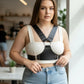 Plus Size black studded leather body sash by HarnessClub with metal rings and studded straps.
