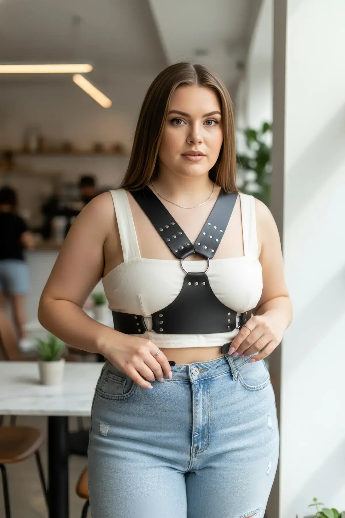 Plus Size black studded leather body sash by HarnessClub with metal rings and studded straps.