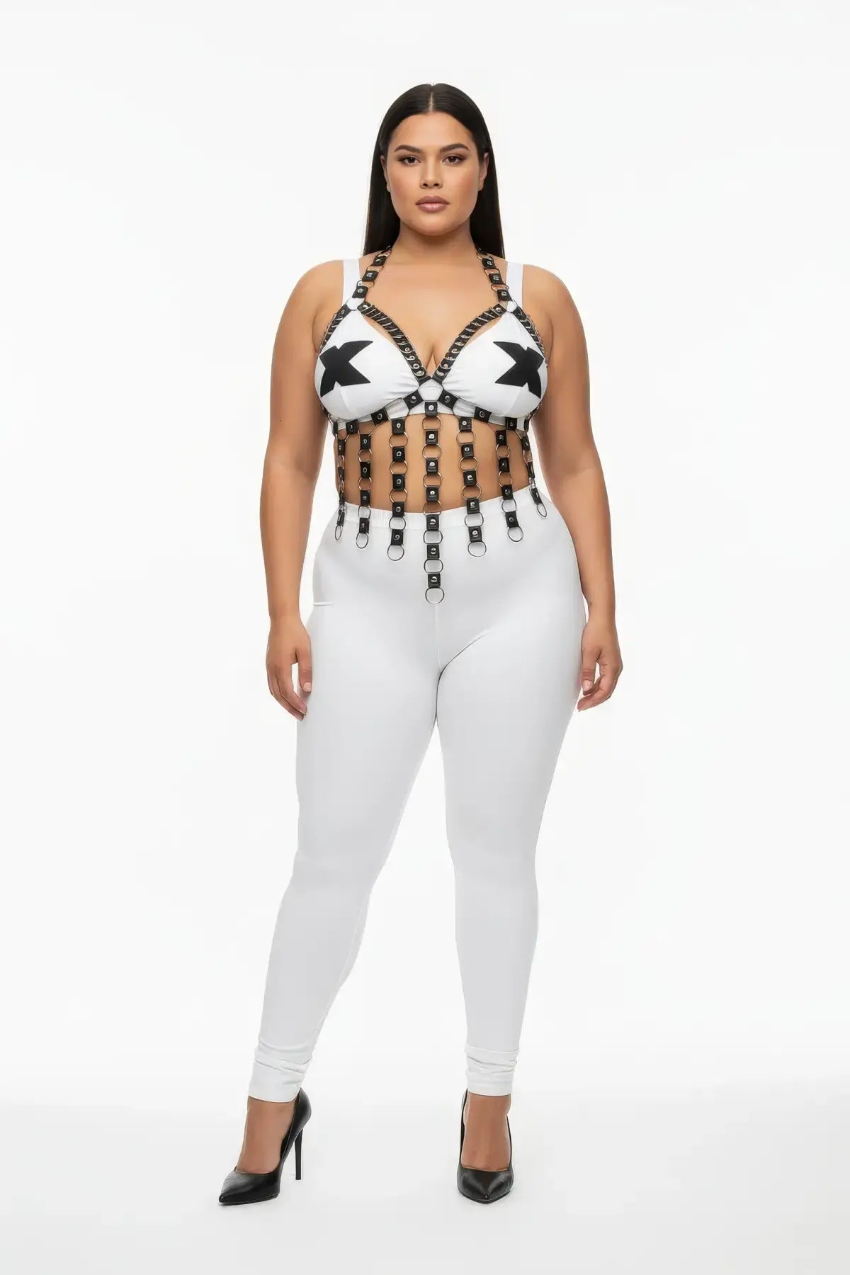 Plus-size black studded vegan-leather V-frame chest harness with O-ring fringe worn by model