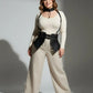 Plus-size black vegan leather suspender corset harness with choker and hip flaps worn by model