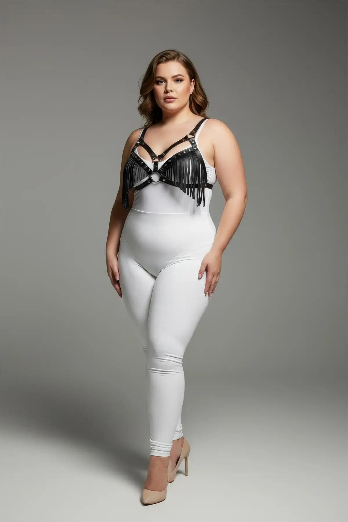 Plus-size black tassel-detail faux-leather bra harness with fringe by HarnessClub.