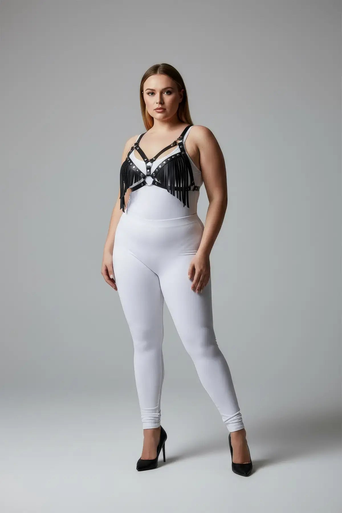 Plus-size black tassel-detail faux leather bra harness by HarnessClub worn by model