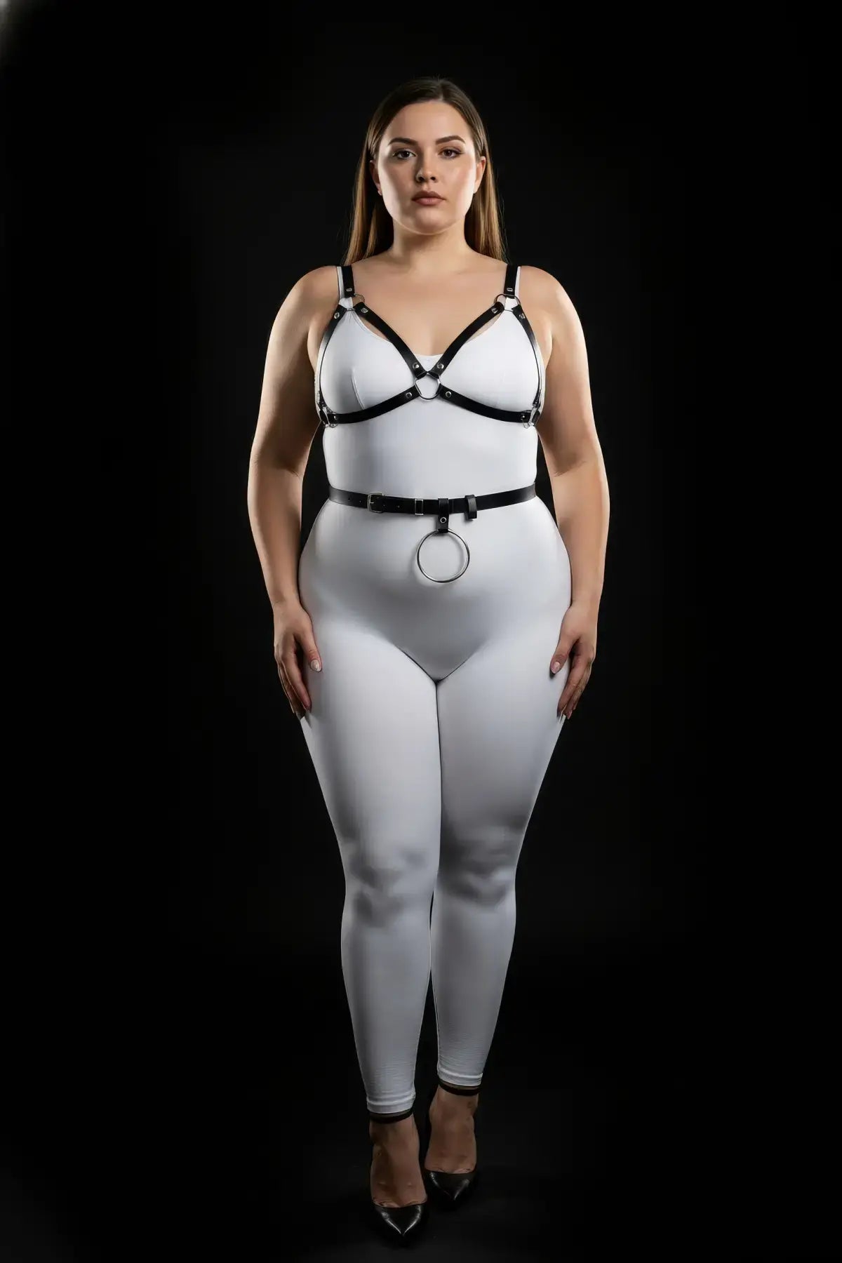 Plus-size black vegan-leather V-bralette and O-ring waist belt harness set by HarnessClub, two-piece.