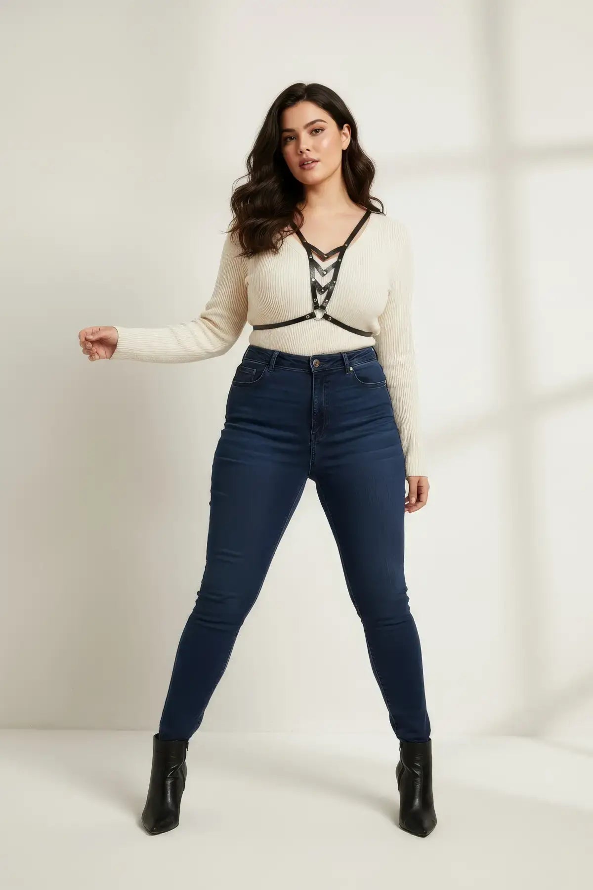 Plus Size Black V-Neck Chest Harness in vegan leather worn over a cream knit sweater; HarnessClub