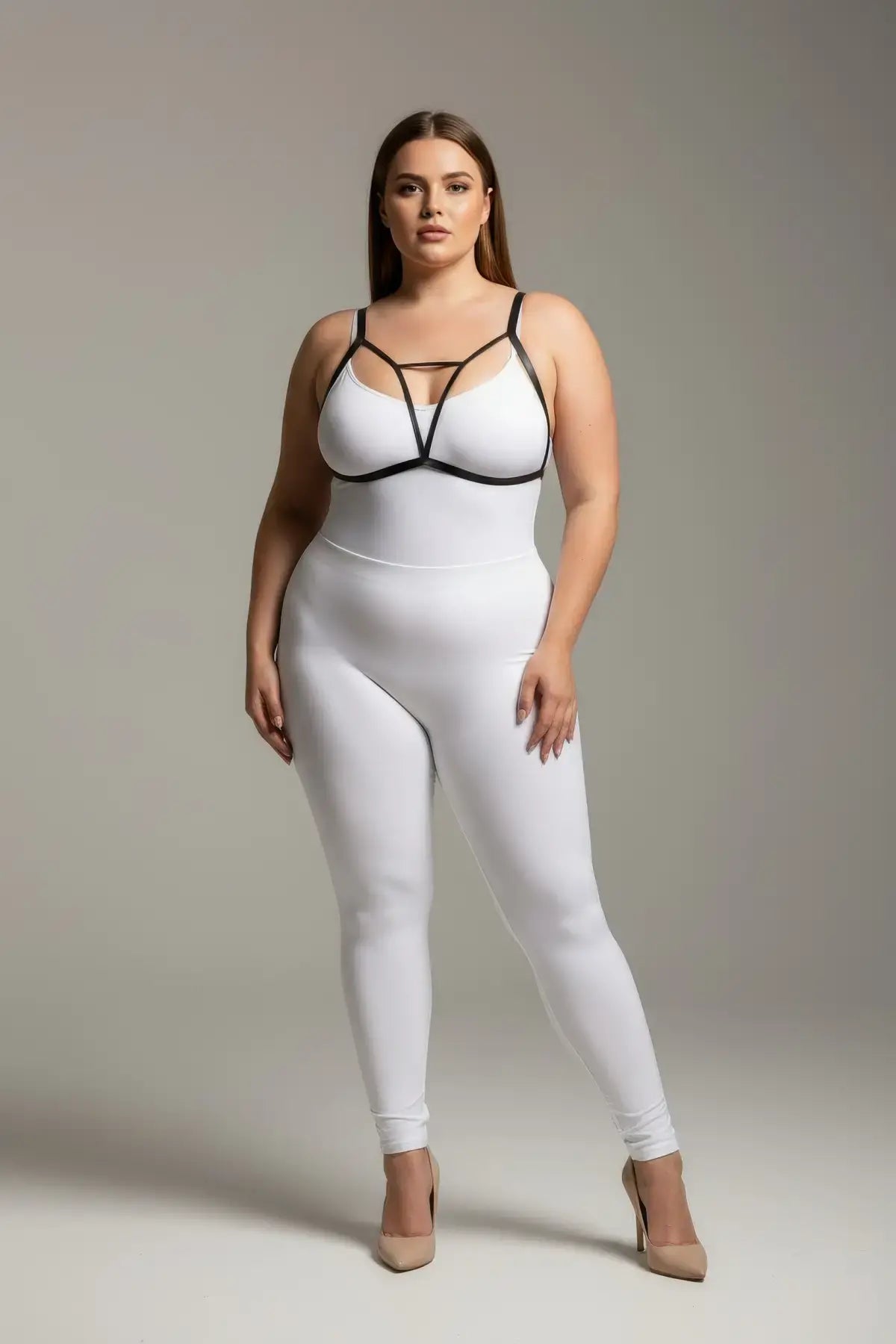 Plus-size black V-strap elastic chest harness with keyhole detail worn over a white bodysuit