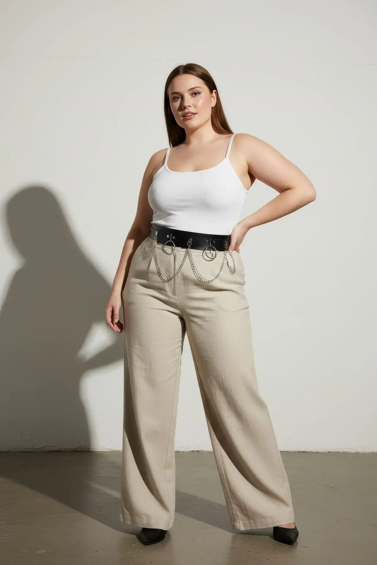 HarnessClub plus-size black vegan leather waist belt with twin O-rings, hanging chains, and metal hardware.