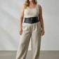 HarnessClub plus-size black wide-cut corsage body harness belt worn at the waist as dress overlay accessory.