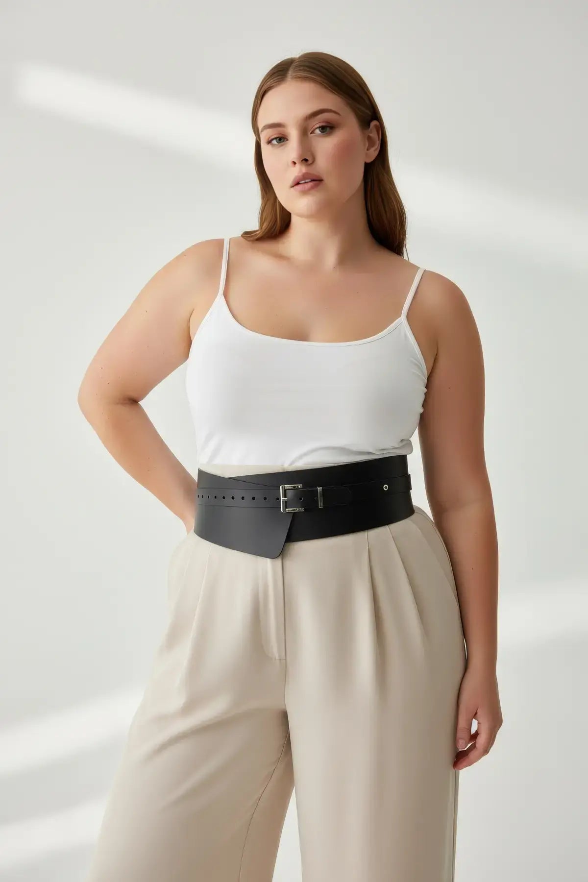 Plus-size black wide-cut corsage body harness belt over a white tank top