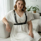 Plus-size black wide-strap shoulder harness with waist belt worn over white dress, HarnessClub.