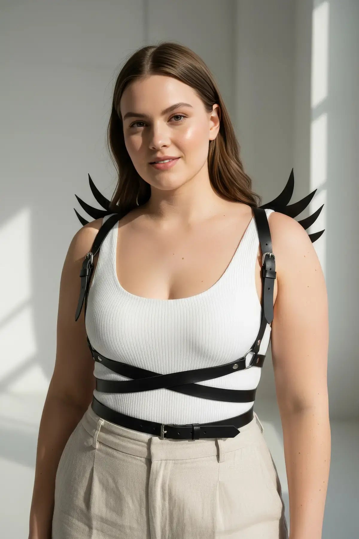 Plus Size Black Wing-Detail Leather Body Harness by HarnessClub worn by model