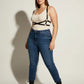 Plus Size Black X-Cross Shoulder Harness by HarnessClub in vegan leather worn over a cream ribbed tank.